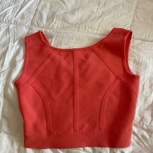 Cute coral cropped tank top! Very fitting and flattering.